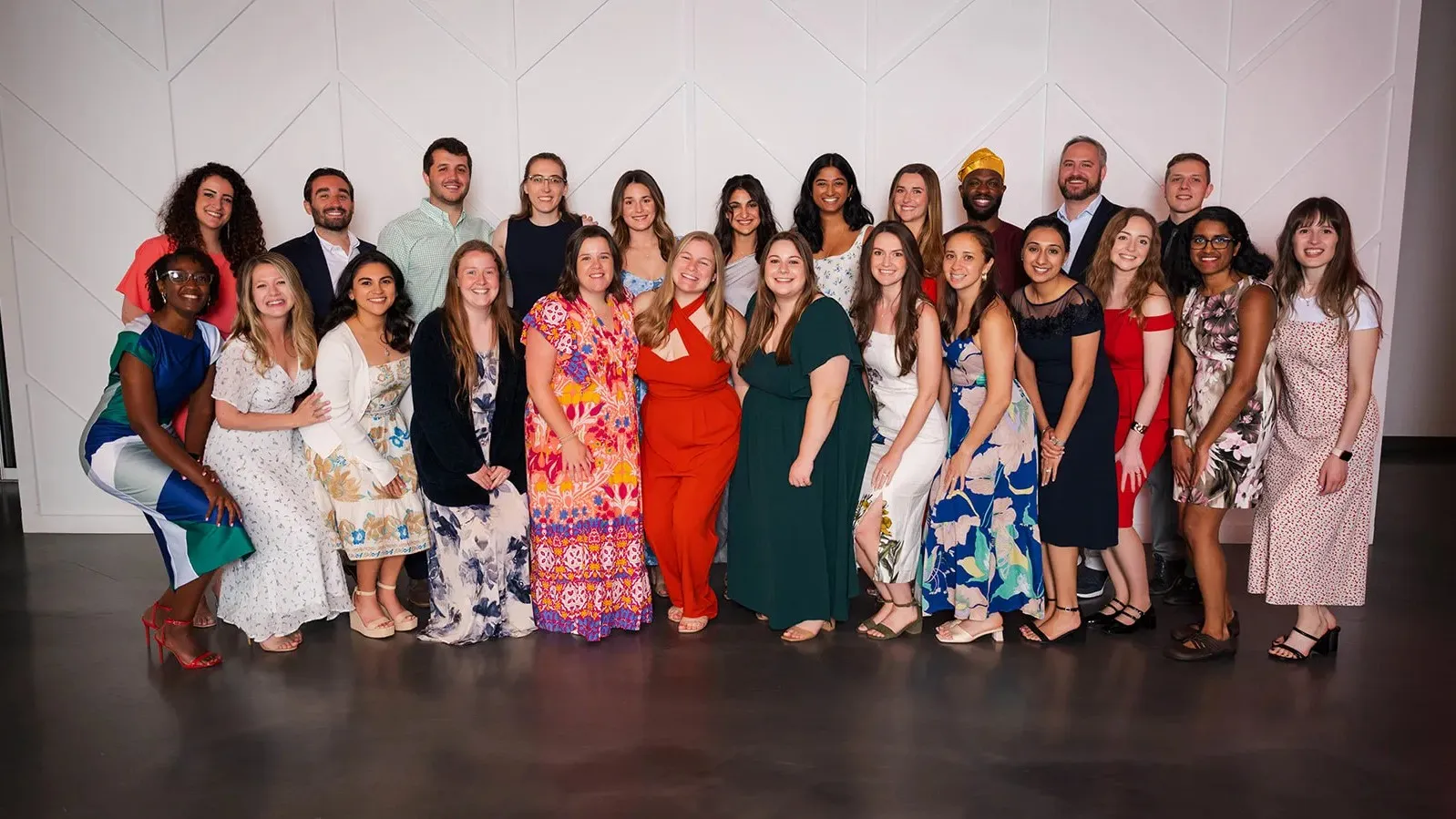 pediatrics residents in formal wear pose together for a large group photo at graduation