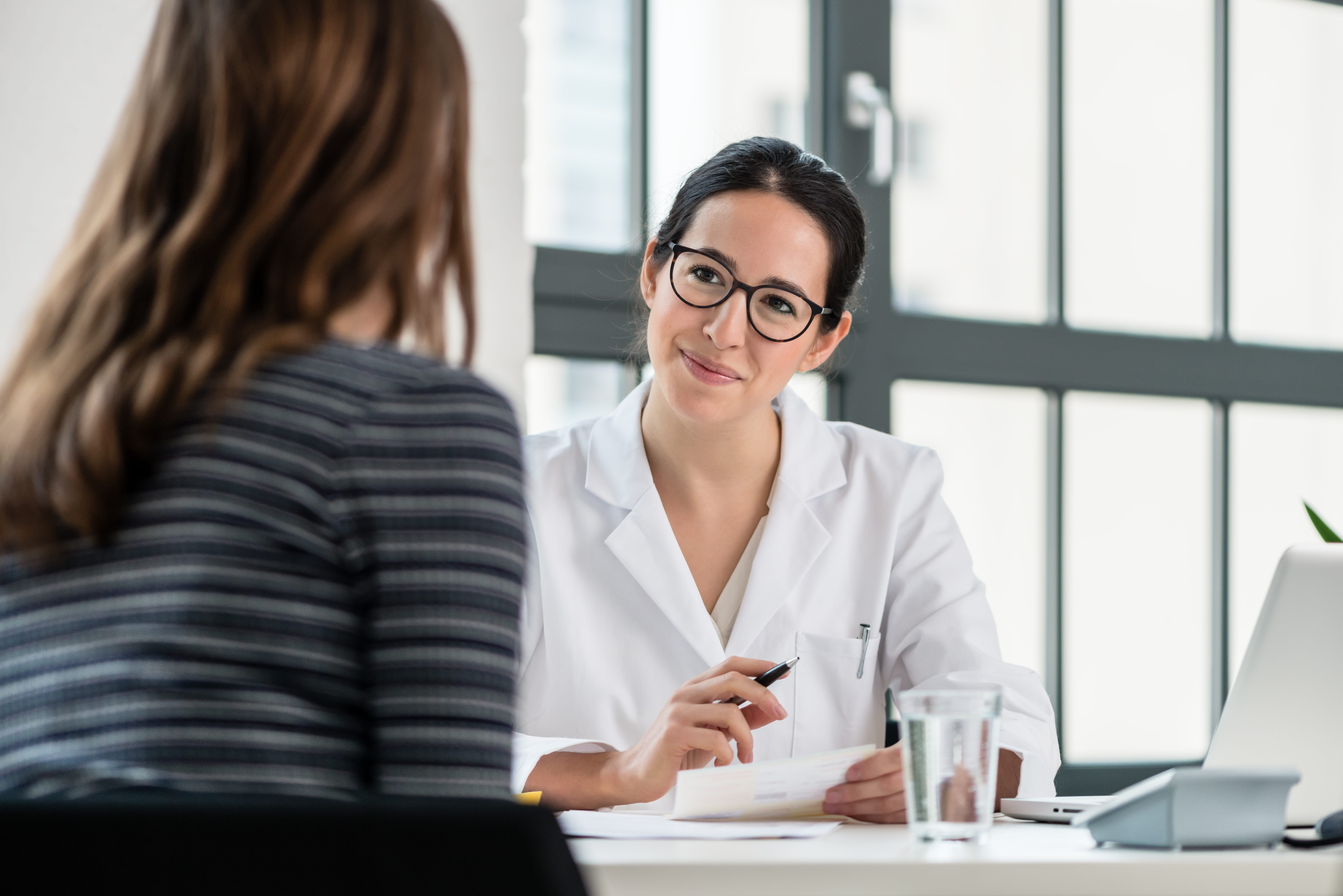 Physician meets with patient
