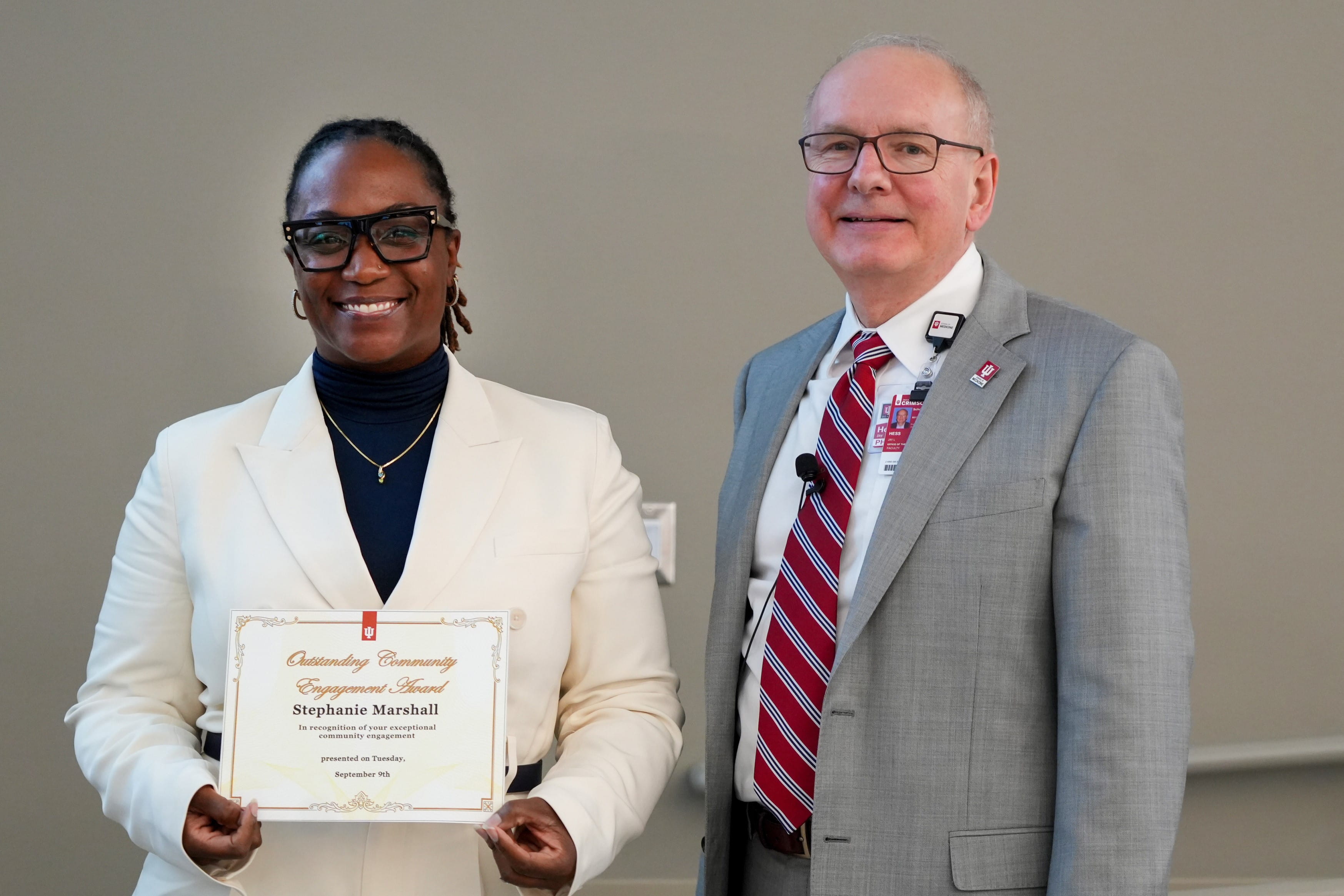 Stephanie Marshall receives an award from Dean Jay Hess