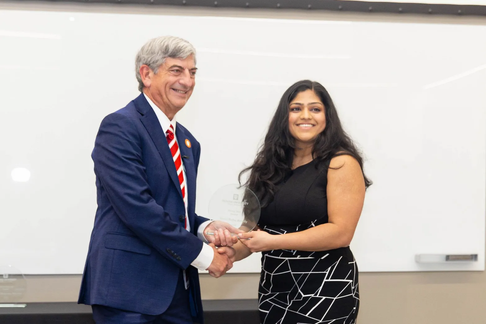 Gouri Babu Ambily receives the Rising Star Award from Dean Boden