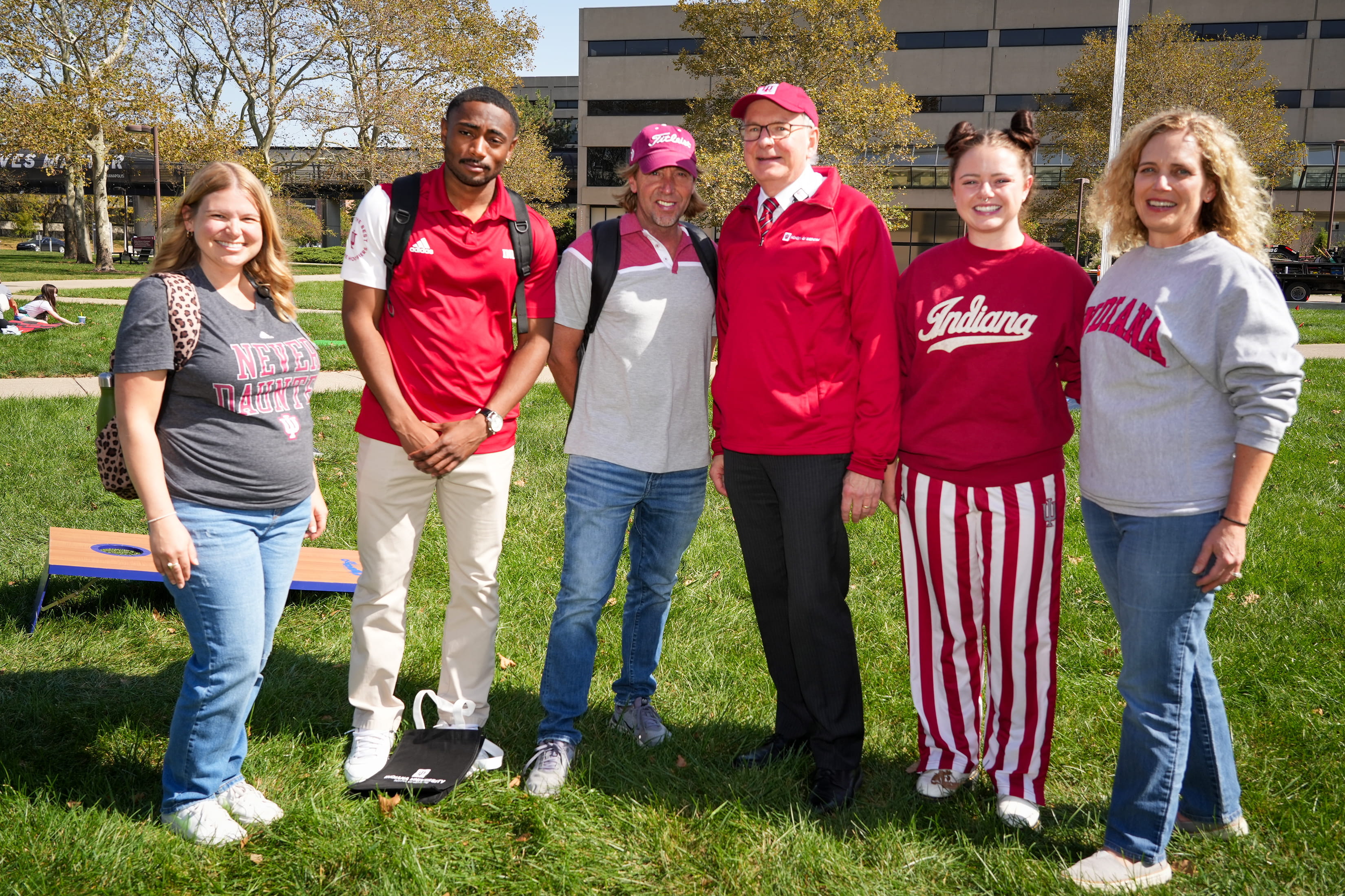 Dean Jay Hess and staff dressed in IU spirit gear outside on a sunny fall day
