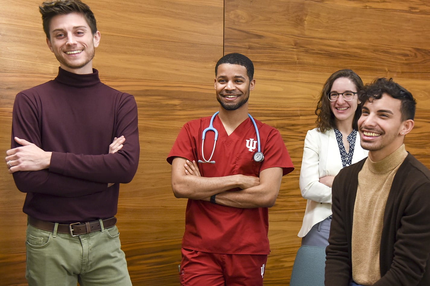 staff members laugh and talk during a team meeting