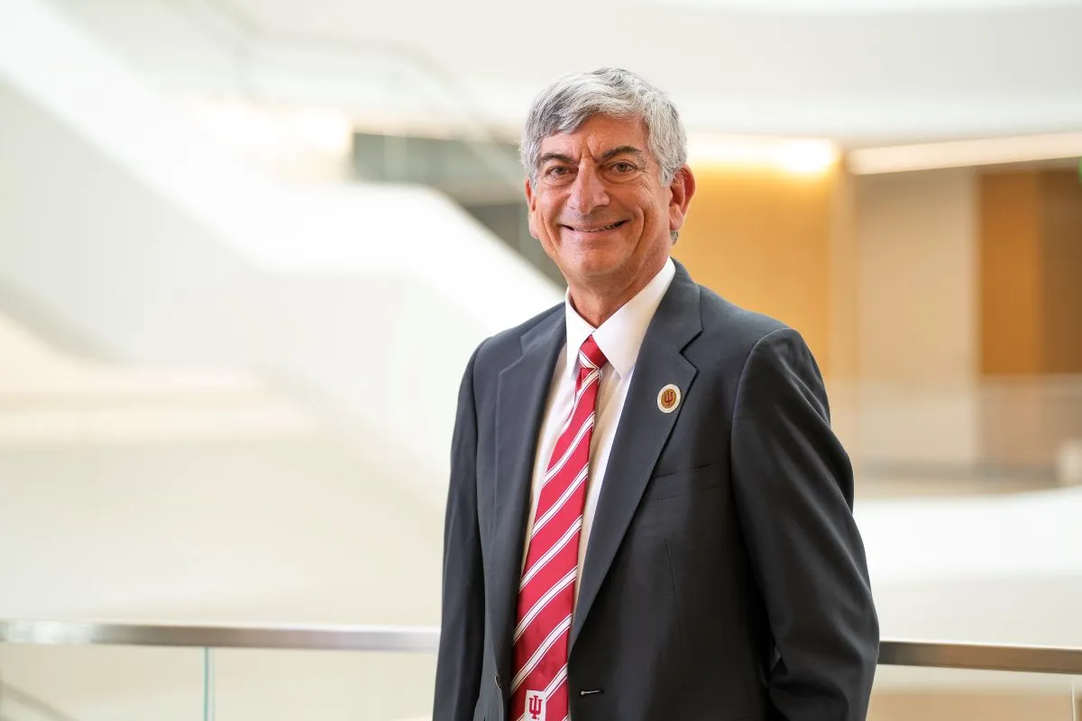 Scott Boden wearing a suit and IU striped tie