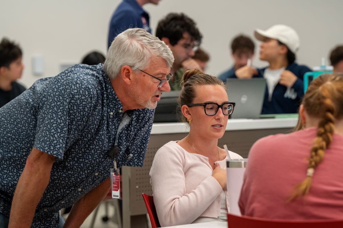 a teacher and medical student work together in histology class