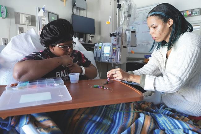 A kid in hospital with therapist