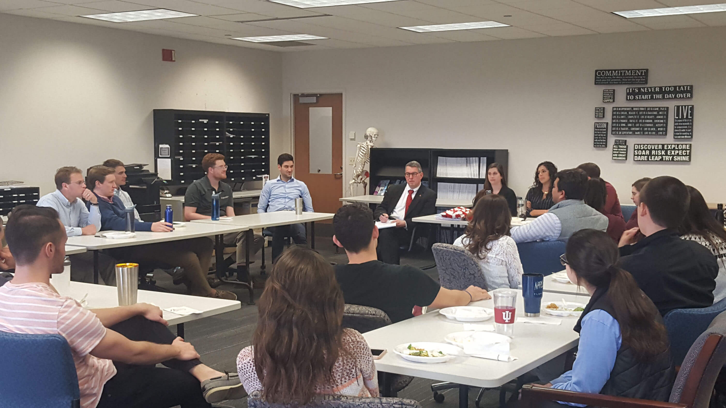 Dr. Wallach speaking with students in Evansville