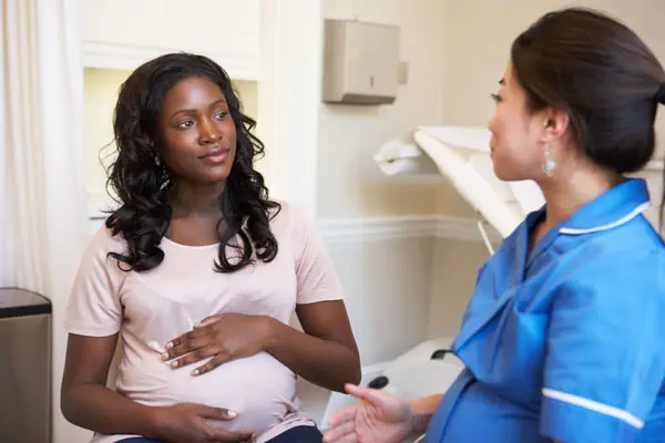 Pregnant Woman And Nurse