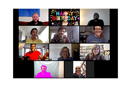 A screen shot of 11 people smiling during a virtual meeting.