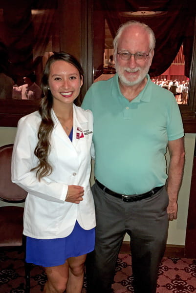 Angel Jones with her father at her white coat ceremony