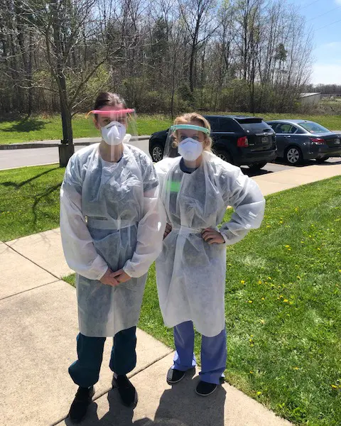 MD students Anna Fenner and Courtney Raab volunteer with the Indiana Department of Health to swab for COVID tests