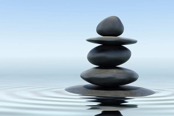 rocks balanced on water