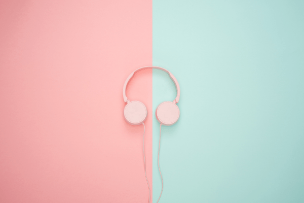 headphones on pink and green background