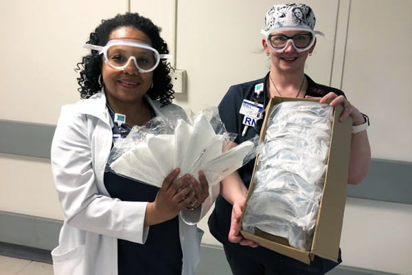 ED managers at Methodist Hospital Northlake-Gary, posing with donations-200 masks and 50 pairs of goggles