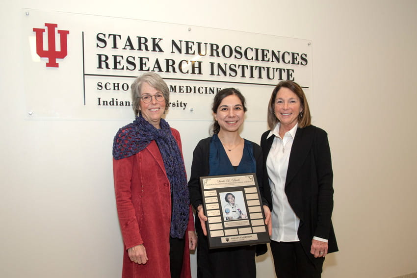 Hande Karahan, PhD, stands with Roush’s daughters, Nancy Carpenter and Dianne Trauring