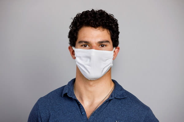 portrait of sean buehler wearing a mask