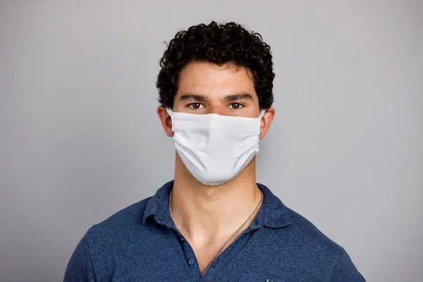 portrait of sean buehler wearing a mask