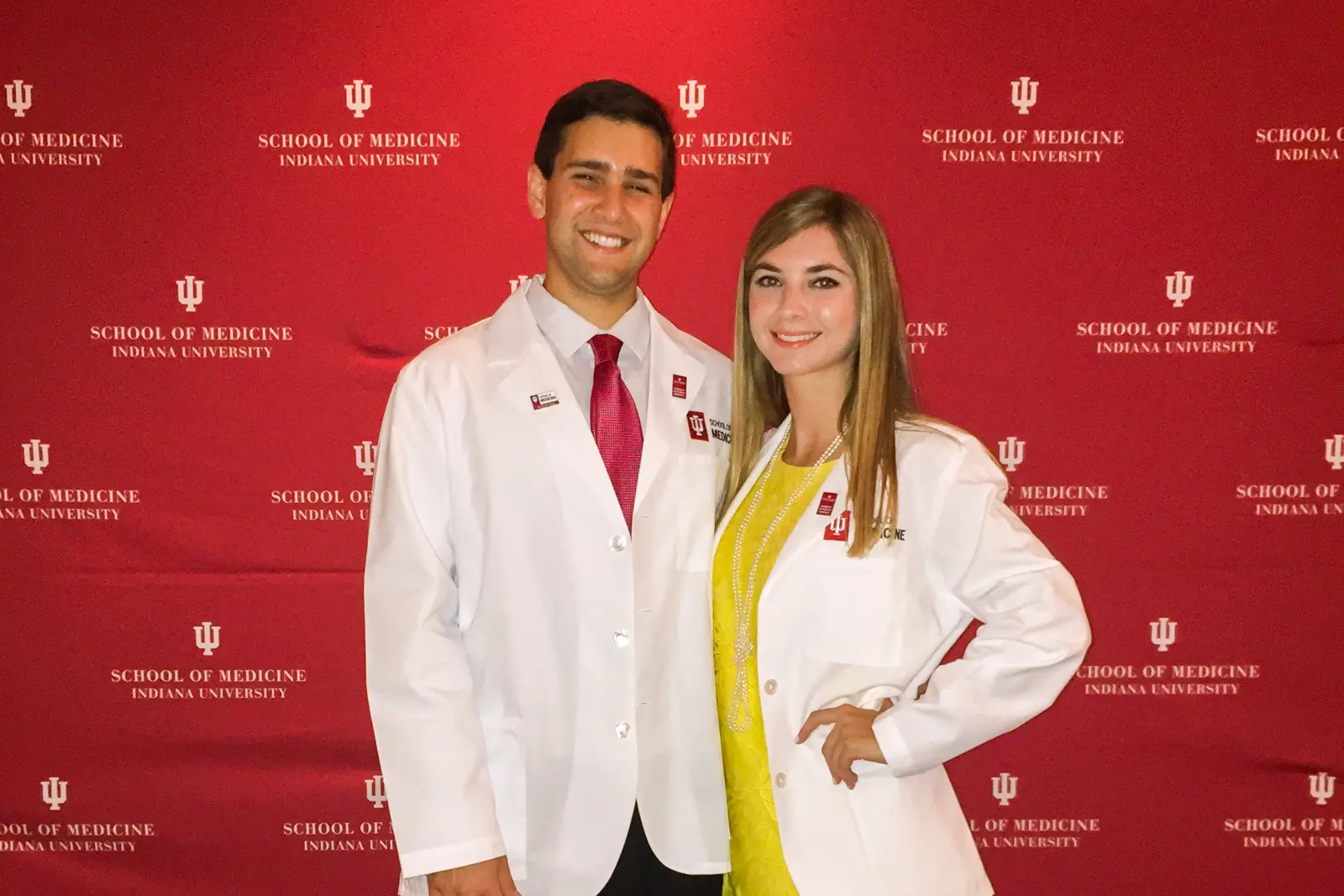 Carlos Martinez and Sarina Masso in white coats