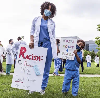 Fauntleroy with son Levi at Black Lives Matter event