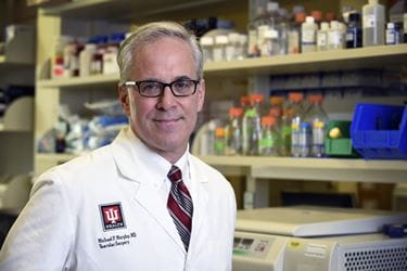 michael murphy stands in his lab