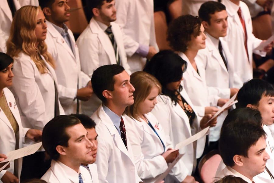 the class of 2020 takes the physician's oath at their white coat ceremony