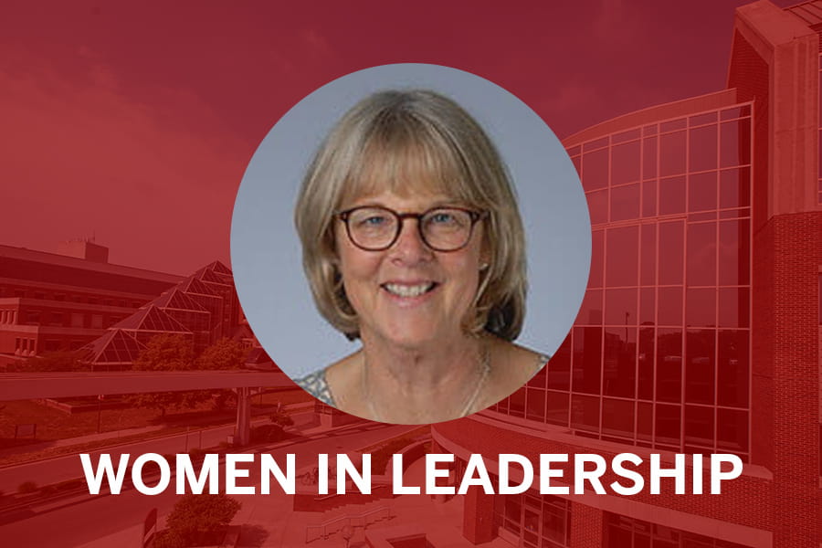 photo of maureen harrington over red background . Text below the image reads "Women in Leadership.