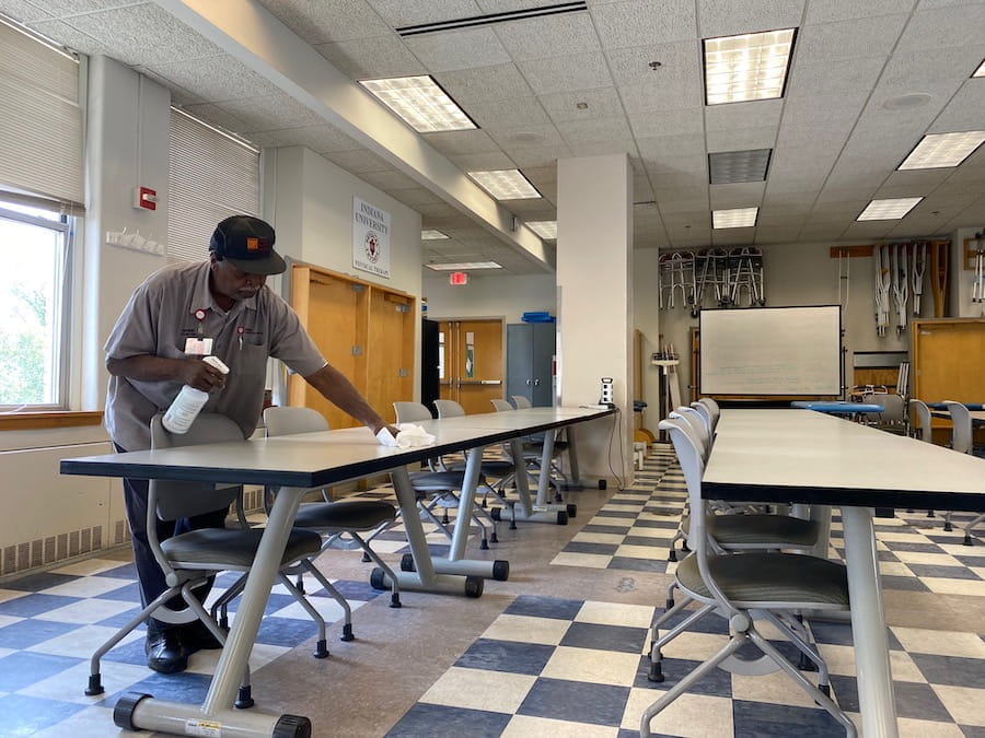 Bennie Porter cleans a Long Hall classroom