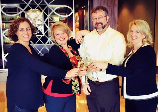 Katherine Hiller, Juliana Jung and colleagues at a conference