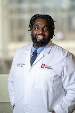 Russell Ledet in white coat