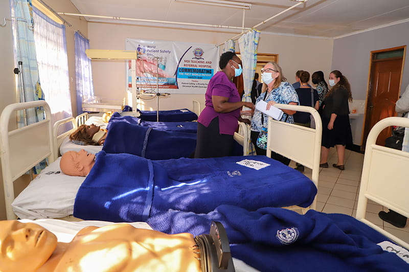 Dr. deRose speaks with a nursing colleague