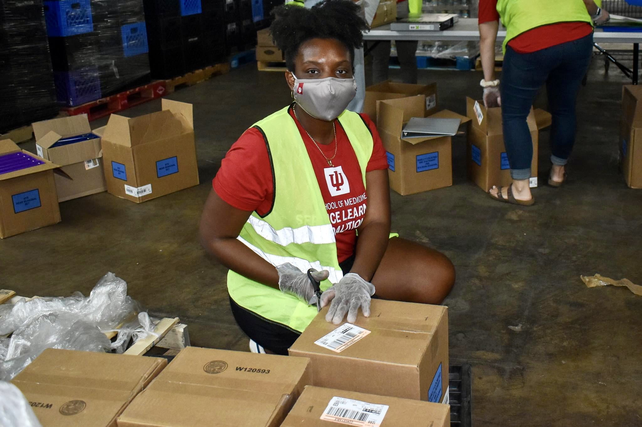 Mia Ndama serving at the food bank