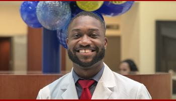 Mychael Spencer in white coat