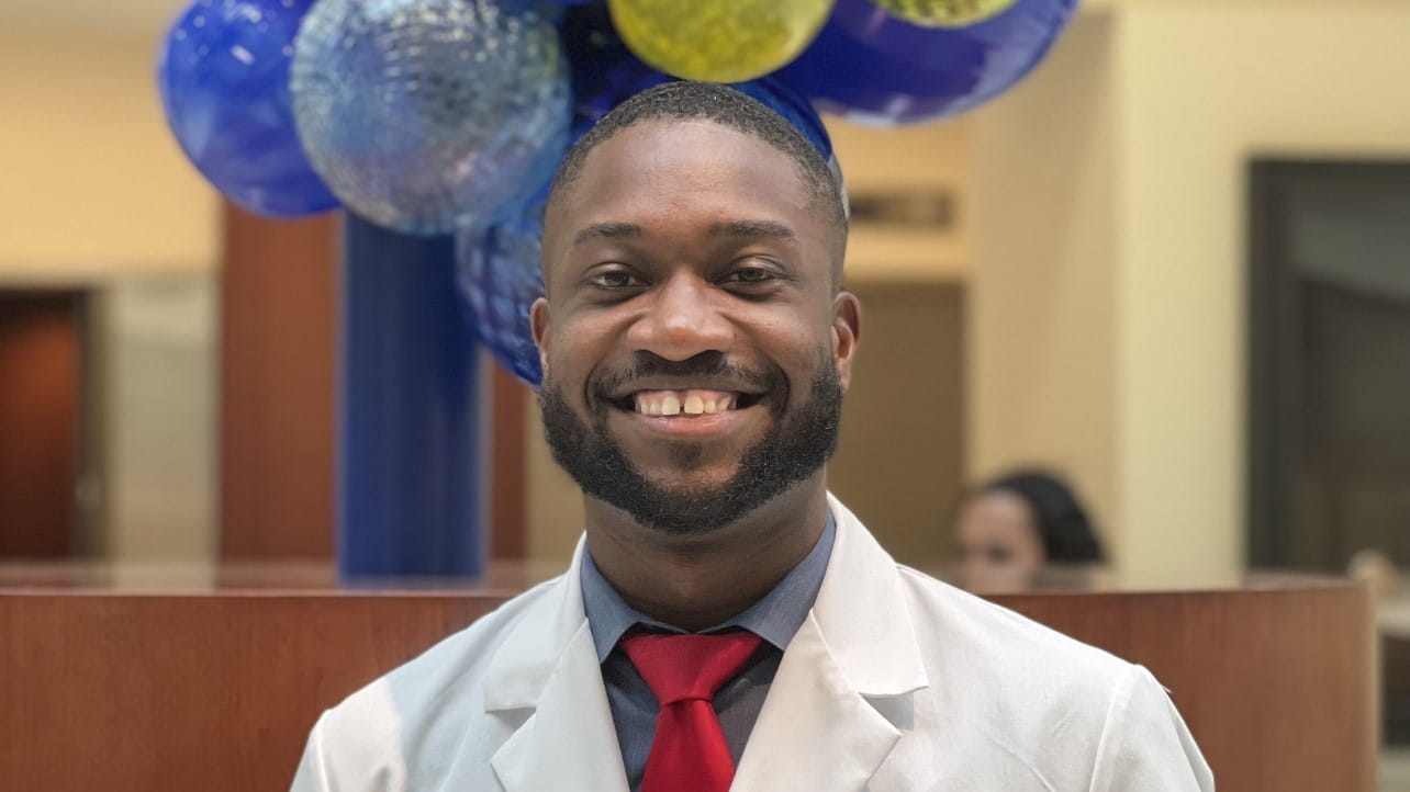 Mychael Spencer in white coat