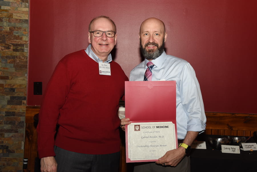 Dean Jay Hess and Gabe Bosslet with award