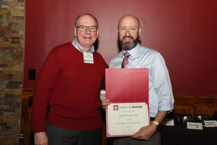 Dean Jay Hess and Gabe Bosslet with award