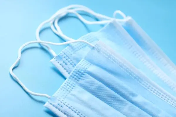 blue surgical masks laying flat