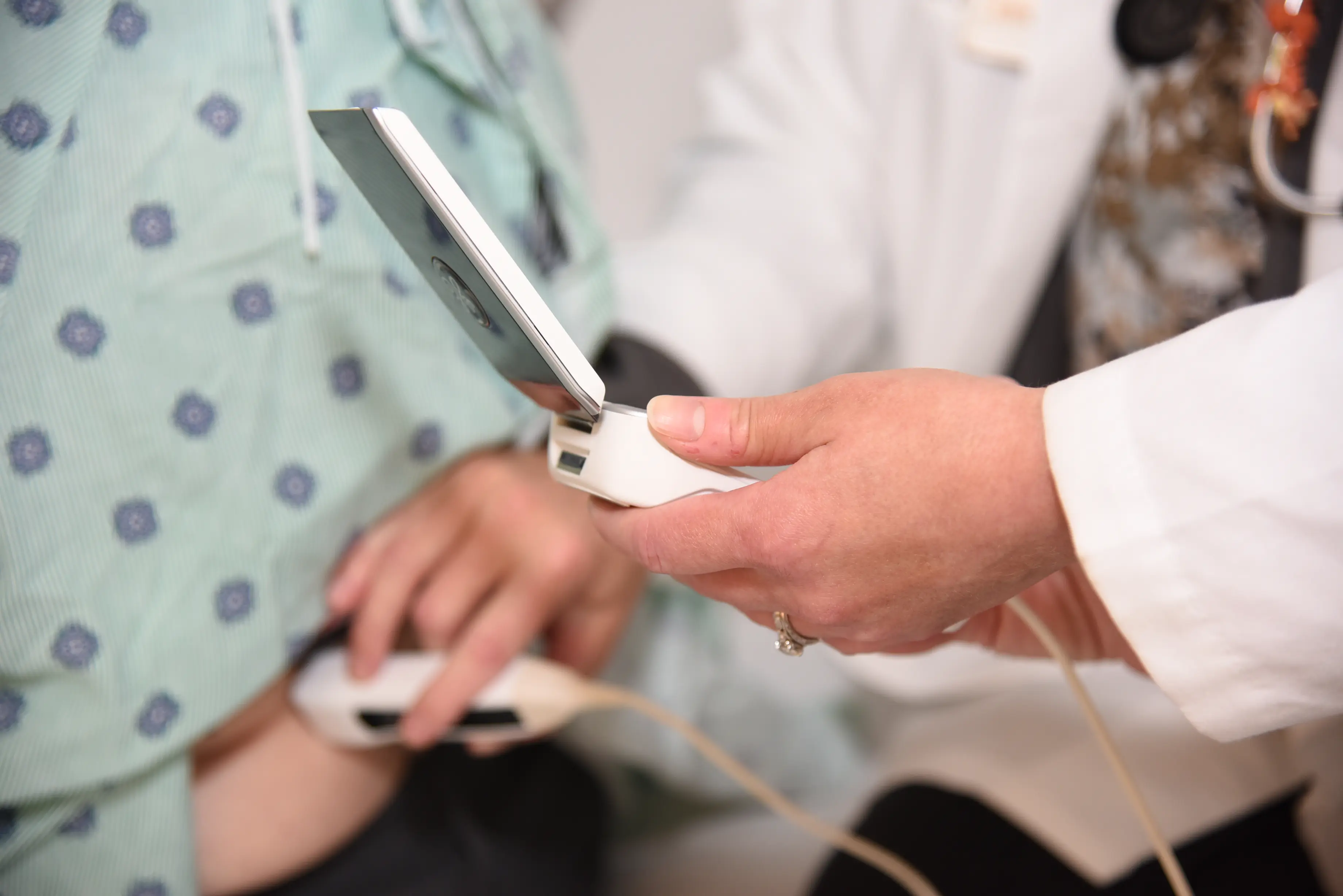 doctor using ultrasound on patient