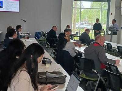 Tables full of participants at the AI conference