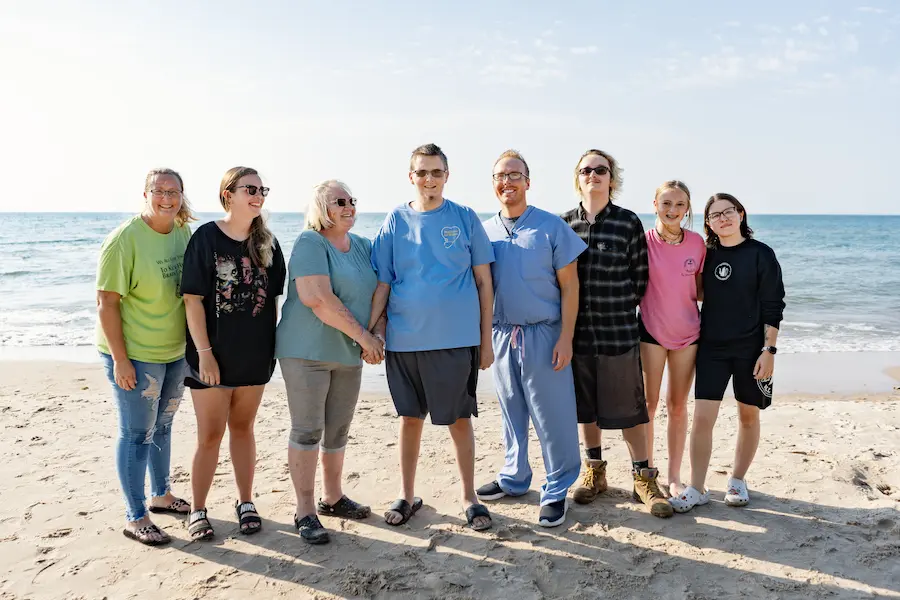 Dr. Gregory Taylor with Devin Loudy and his family at Lake Michigan