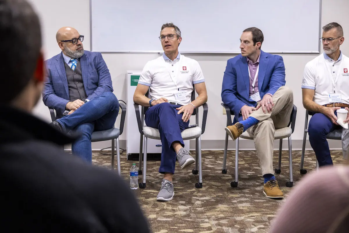 Dr. Clint Cary speaks during a Q&A with medical experts, alongside Geo Espinosa, Sean Kern and Timothy Masterson. 
