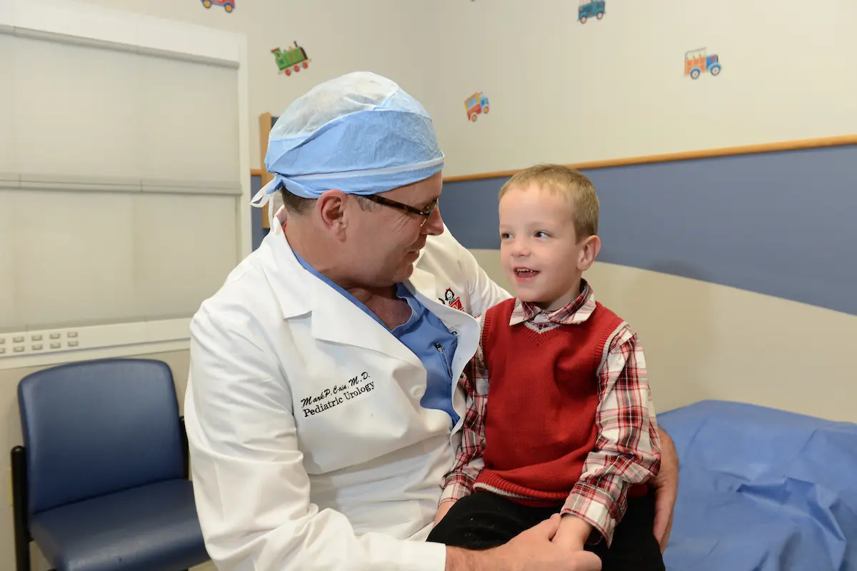 Dr. Mark Cain with a patient at Riley Hospital for Children