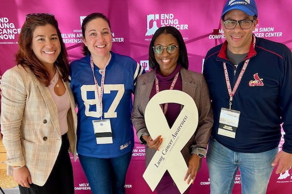 Duncan holding white ribbon with with Sylk Sotto, Catherine Sears and Nasser Hanna