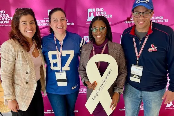 Duncan holding white ribbon with Sylk Sotto, Catherine Sears and Nasser Hanna