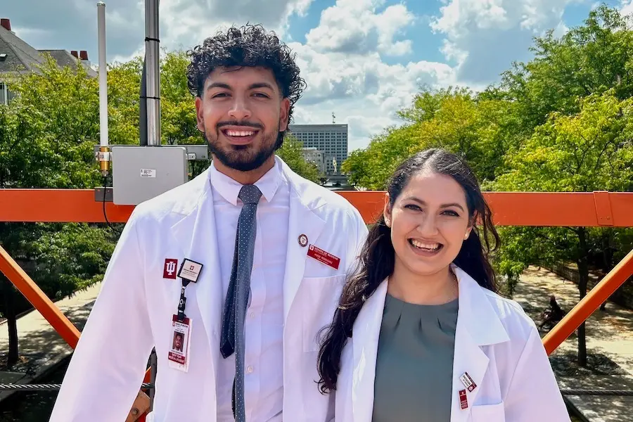 Hugo and Alejandra Rodriguez in white coats