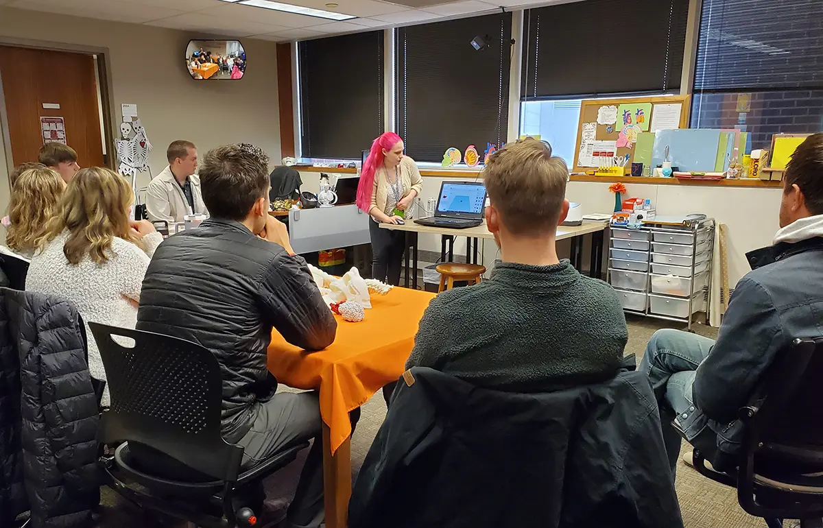 Master's Students in the Anesthesiologist Assistant Program listen as Nexus Manager Cassandra Jones explains how to use TinkerCAD, a beginner-friendly free 3D modeling software.Nexus Manager Cassandra Jones leads 3D-printing workshop in the RLML Makerspace.
