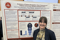 IU School of Medicine student poses for photo in front of their poster presentation at 2024 SSRFC Annual Conference.