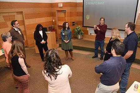 Participants in a Communicating Science workshop stand in a circle for an exercise called "The 2-minute Rant."