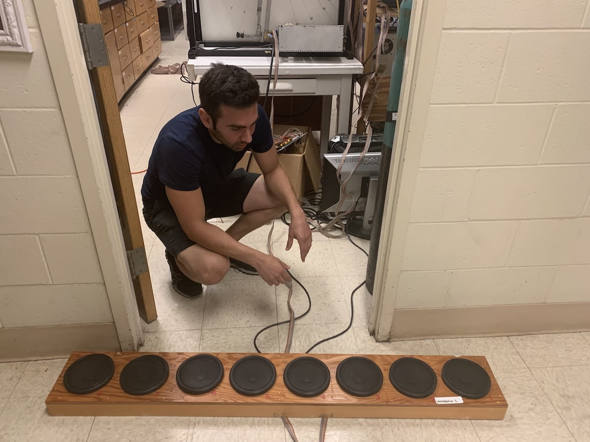 Ed Rogers listens to the first recordings of mini-brain talk in Indiana.