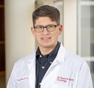 Thomas Everett in his white coat