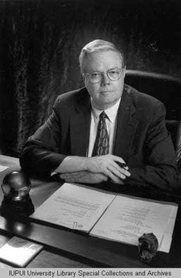 Walter J. Daly at his desk Black and white photo of Walter Daly at his desk in 1983