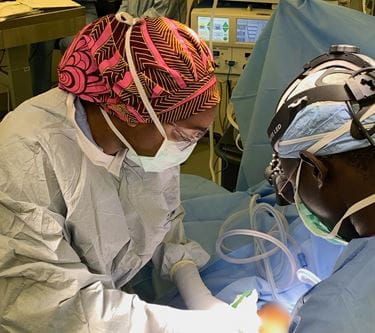Jasmine Lee, MD, in surgery during her residency at the IU School of Medicine. Jasmine Lee, MD, performs surgery in an OR.